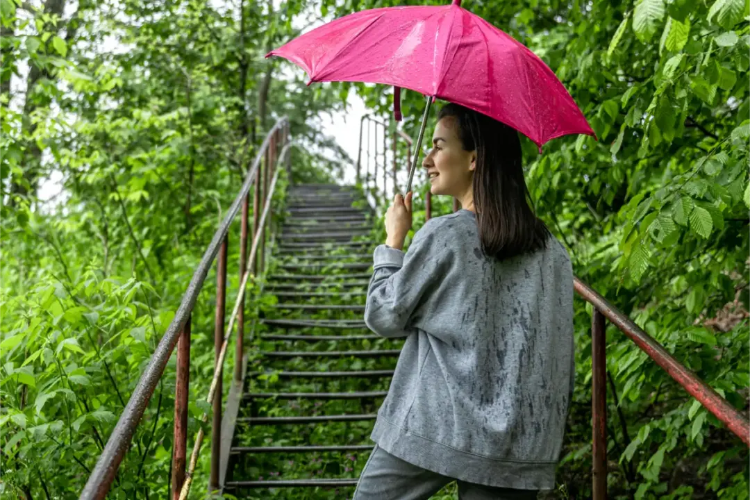girl-umbrella-walk-rainy season in amazon